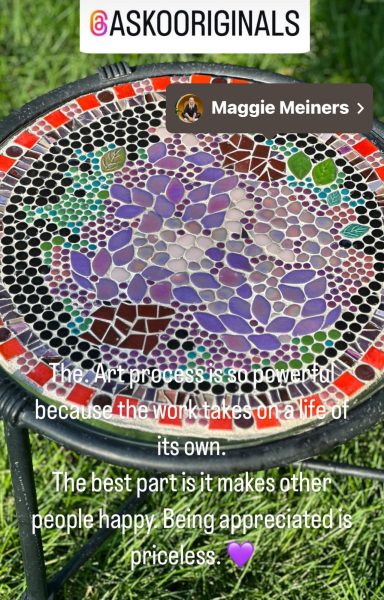 Flower garden table Colorful mosaic design featuring flowers and abstract shapes on a round surface.