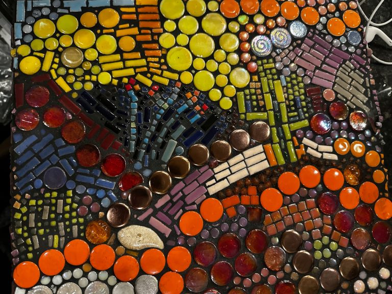In The Desert Colorful abstract mosaic with circular and geometric patterns in various shades.